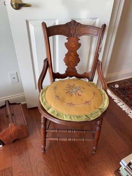 Antique chair originally cane bottom  that has been altered to a hard bottom with chair cushion image