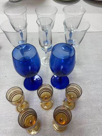 Blue stemmed wine glasses ( one rim has small chip ), 2 cobalt blue Libbey  stems, one clear Towle champagne glasses and set of 5 vintage cordials ( one has chip on rim ) image