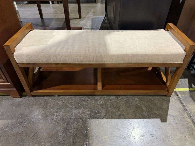Wooden bench with cushion image