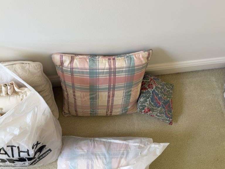Pillows in various pattern, rug pad image