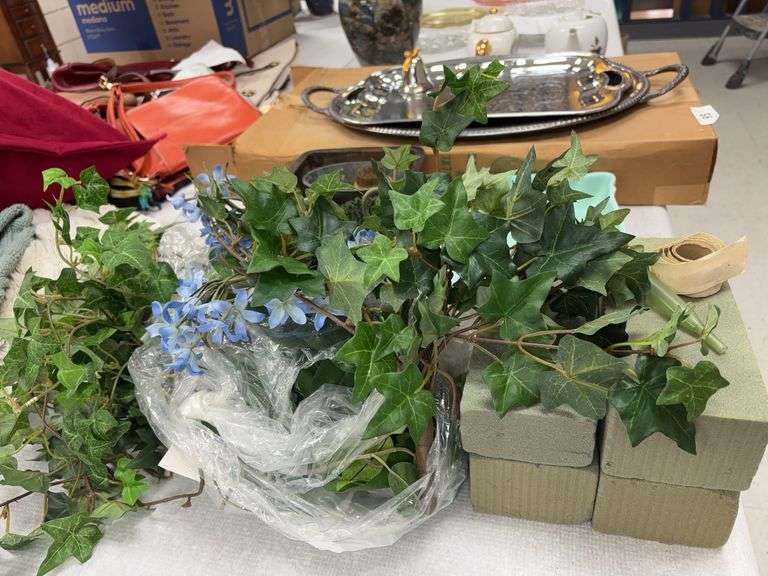 Vintage flower frogs ( one is a blue ribbon), cast iron planter, Haeger Planter, styrofoam , artificial ivy and floral stem image