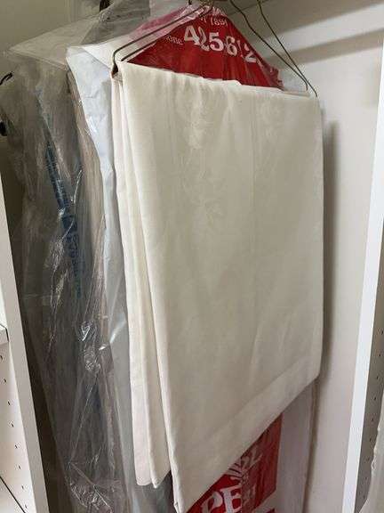 Several vintage tablecloths and cloth napkins image