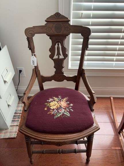 Antique chair with needle point cushion image