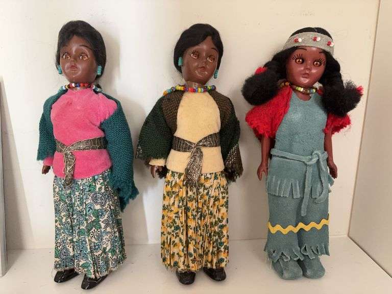 Indian dolls , beads , trivet and carved wooden head image
