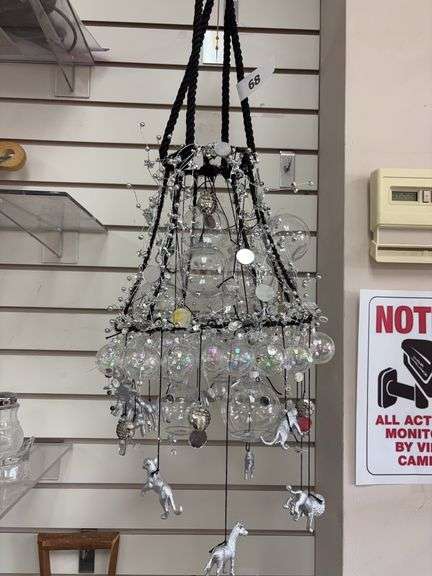Clear plastic Christmas bulb chandelier with rubber silver painted safari animals image