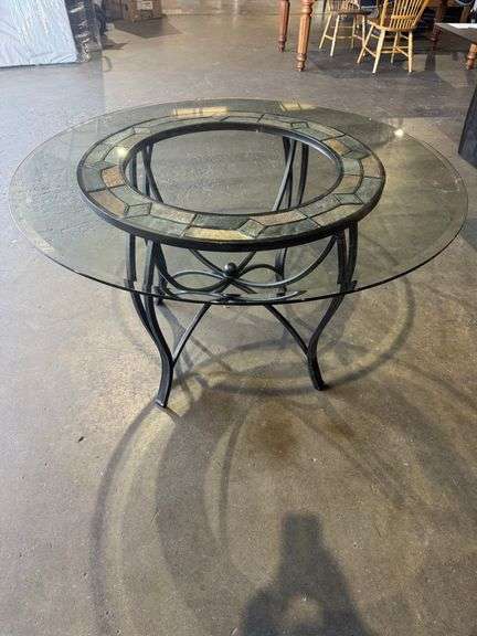 48” round glass top table with iron base and granite stone inlay. 29” high. Retail price $849 image