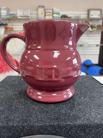 Burgundy Longaberger pitcher has chip on rim image
