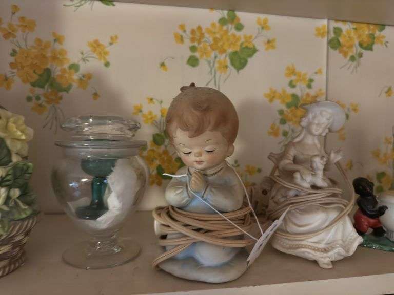 Top shelf of miscellaneous ceramic pieces