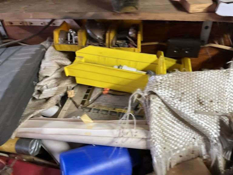 Contents of Work bench & contents (excluding saw sharpener)