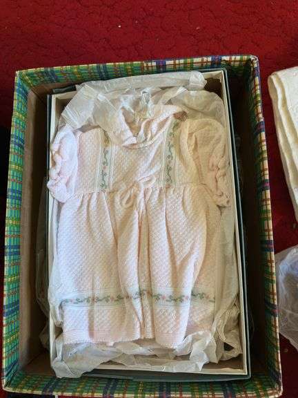 Box of crochet baby items and box of children’s shoes