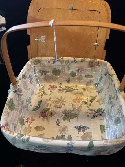 Longaberger Classic pie basket with botanical gardens liner/protector and copper tin punch insert in lid that is an aftermarket addition .