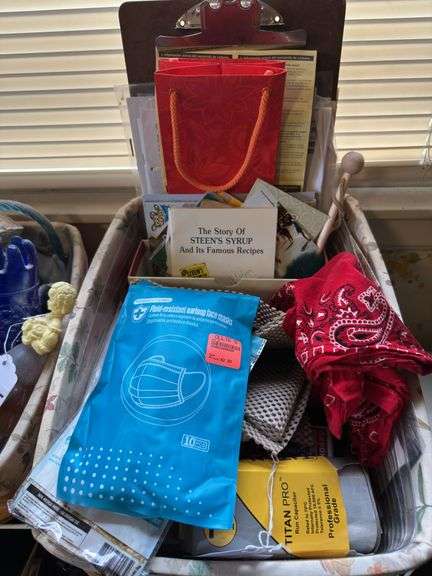 Various items in longaberger basket, playing cards, face masks