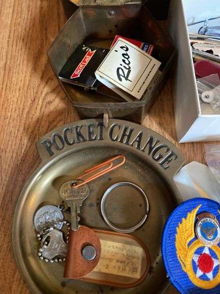 Metal box, keys, metals, dice, patch, etc