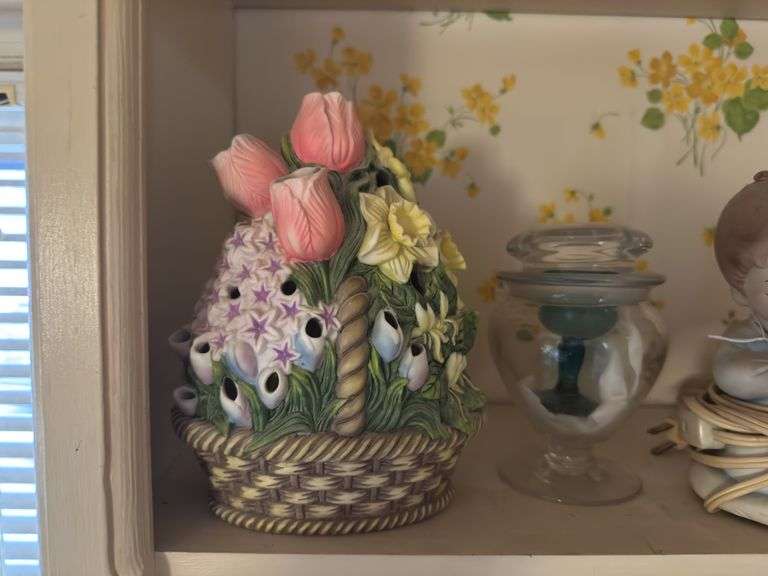 Top shelf of miscellaneous ceramic pieces