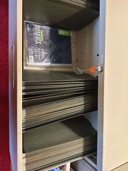 2 drawer file cabinet with key and items in drawers. 18” x 35” x 28” h