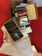 Box of crochet baby items and box of children’s shoes