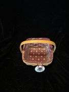 Longerberger classic purse with burgundy liner and maple leaf tie on and also has a patriotic extra liner . Dated and signed see picture . Classic berry basket with swinging handle that includes classic burgundy liner and protector dated 2000.