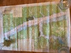 Assortment of posters, maps, newspapers
