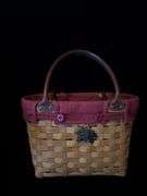 Longerberger classic purse with burgundy liner and maple leaf tie on and also has a patriotic extra liner . Dated and signed see picture . Classic berry basket with swinging handle that includes classic burgundy liner and protector dated 2000.