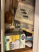 Lightbulbs, tools, books, glass slides