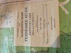 Assortment of posters, maps, newspapers
