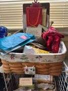 Various items in longaberger basket, playing cards, face masks