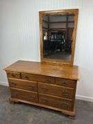 Ethan Allen maple seven drawer dresser with mirrored back