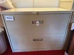 2 drawer file cabinet with key and items in drawers. 18” x 35” x 28” h