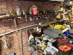 Contents of Work bench & contents (excluding saw sharpener)