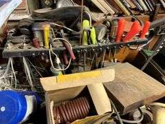 Contents of Work bench & contents (excluding saw sharpener)