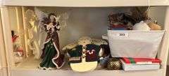 Shelf of misc Christmas items: angels by Home Interior