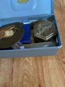Metal box, keys, metals, dice, patch, etc
