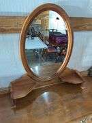 Ethan Allen maple seven drawer dresser with mirrored back