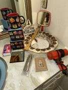 Plastic serving bowl, lighthouse wall hanging, sand painting mini picture, 2 cat mugs, hairdryer, back scratcher, shower curtain hooks