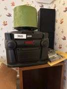 3 CD changer plus 2 speakers wooden cabinet 46” h x 13” w x 12” d , record holder and records and cassettes