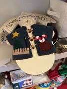 Shelf of misc Christmas items: angels by Home Interior