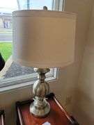 Pair of Lamps - Black Shade w/Brass Base  28"t; Cream Shade w/Silver Metal Base 26"t