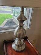 Pair of Lamps - Black Shade w/Brass Base  28"t; Cream Shade w/Silver Metal Base 26"t