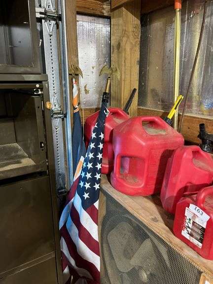 5 plastic gas cans, flags
