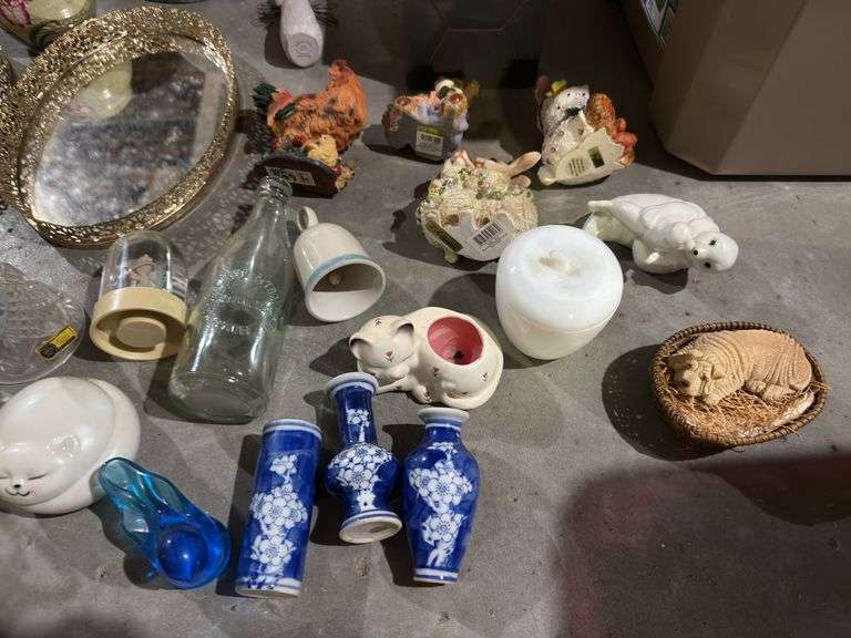 Tub of misc: mirrored tray, brass hurricane lamp, willow tree figure, carnival glass toothpick, glass vases, brass candle holder, figurines