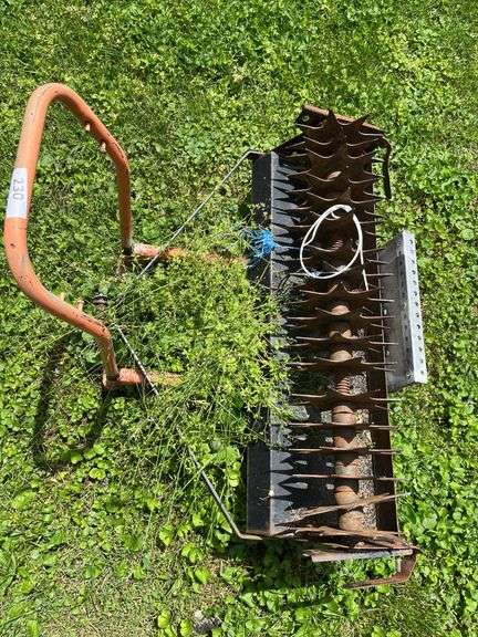 Pull behind lawn aerator on utility dolly