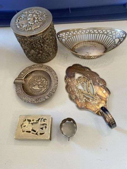 Silver plated candlesticks, sniffers, tobacco container, ashtray, utensils, miscellaneous