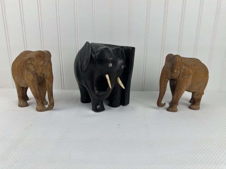 Carved elephants and Buddhist boat