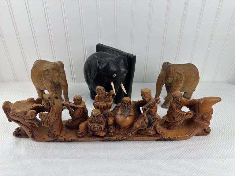 Carved elephants and Buddhist boat