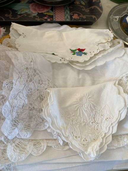 Place mats, linen napkins, lace table mats