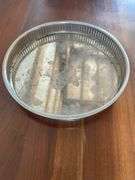 Silver plated dishes, basket weave with glass liner, charger, round reticulated and 3 footed basket