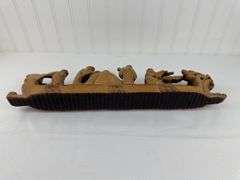 Carved elephants and Buddhist boat