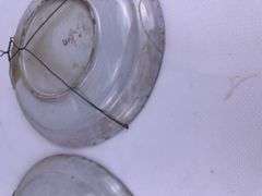 Pair antique hand painted decorative wall plates (one previously repaired)