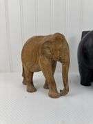 Carved elephants and Buddhist boat