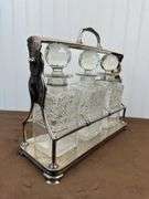 Liquor decanters in silver plated stand